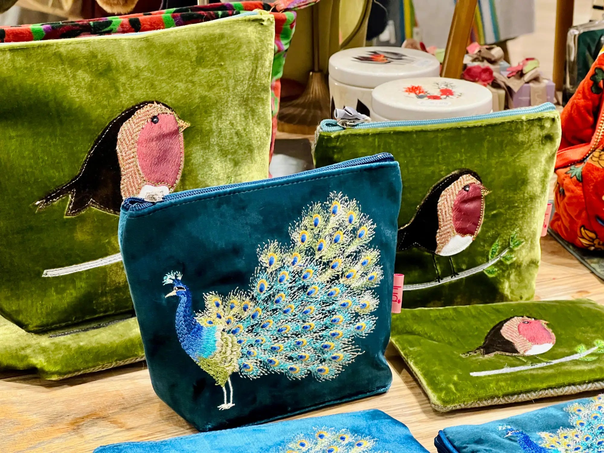 Teal velvet pouch with embroidered iridescent peacock for her gifts
