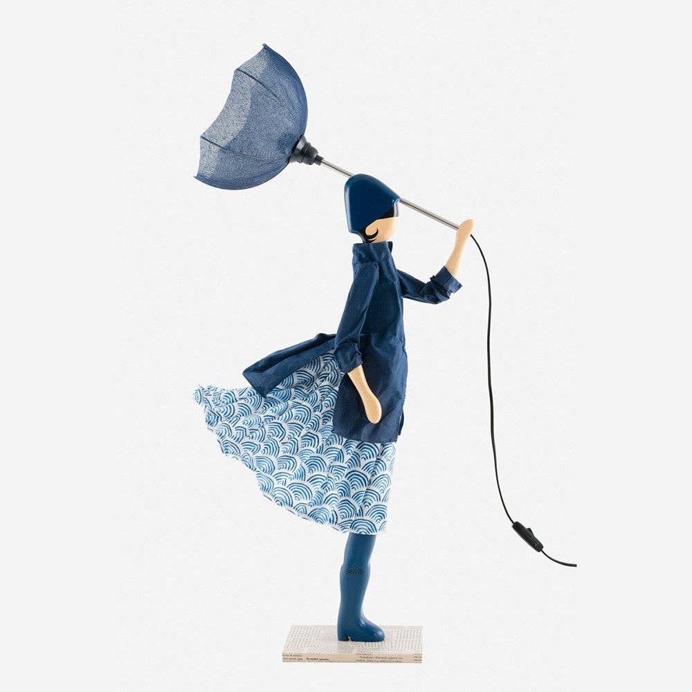 Whimsical Nami Lady Lamp: blue figurine in navy coat holding umbrella