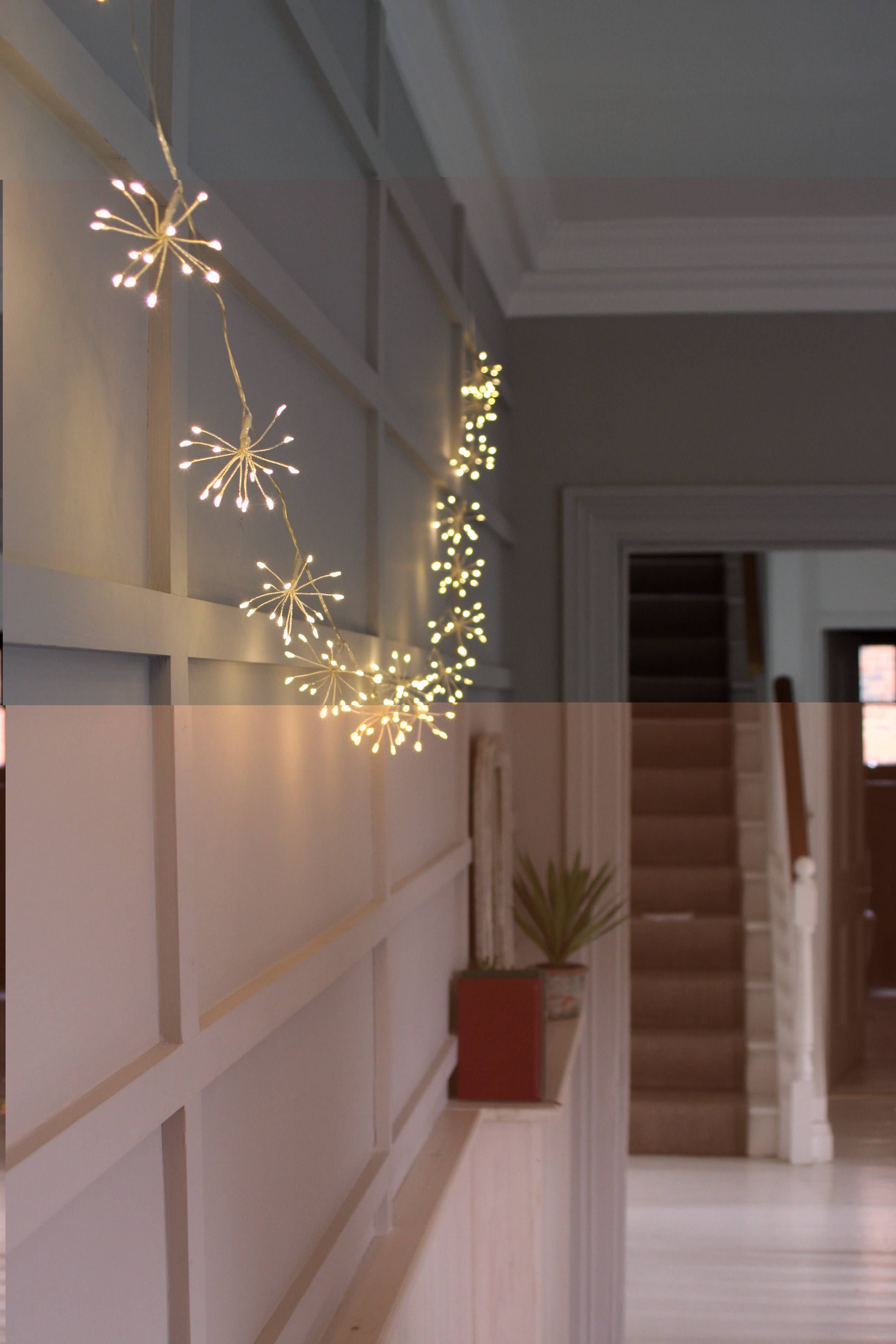 Warm white LED starburst fairy lights on black battery chain