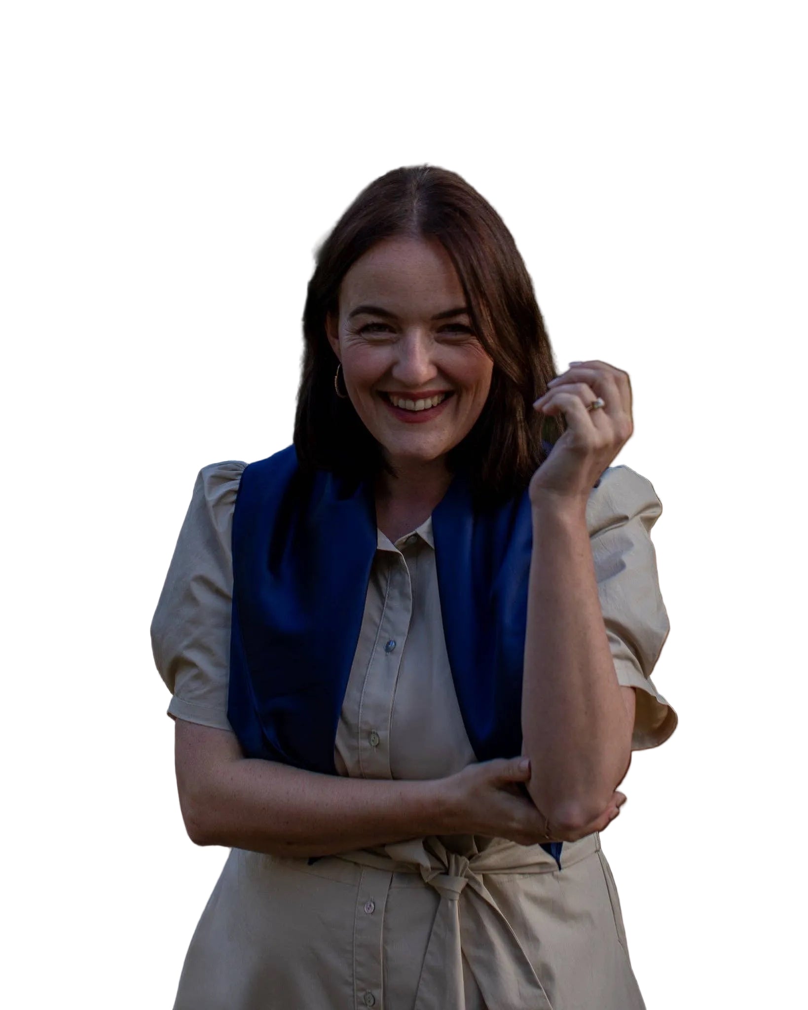 Woman smiling outdoors with a natural background