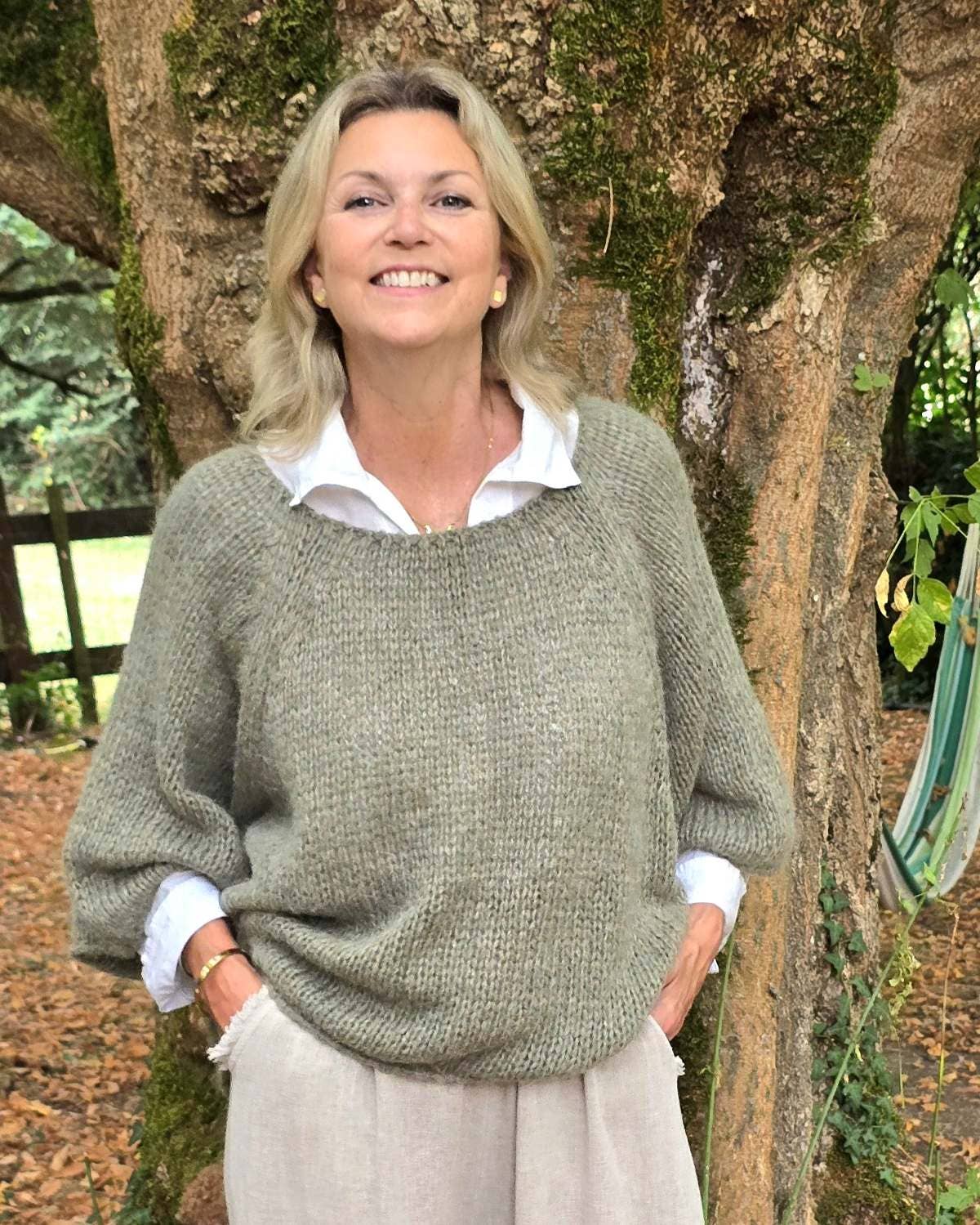 Olive green alpaca blend swing jumper with oversized fit and ribbed cuffs