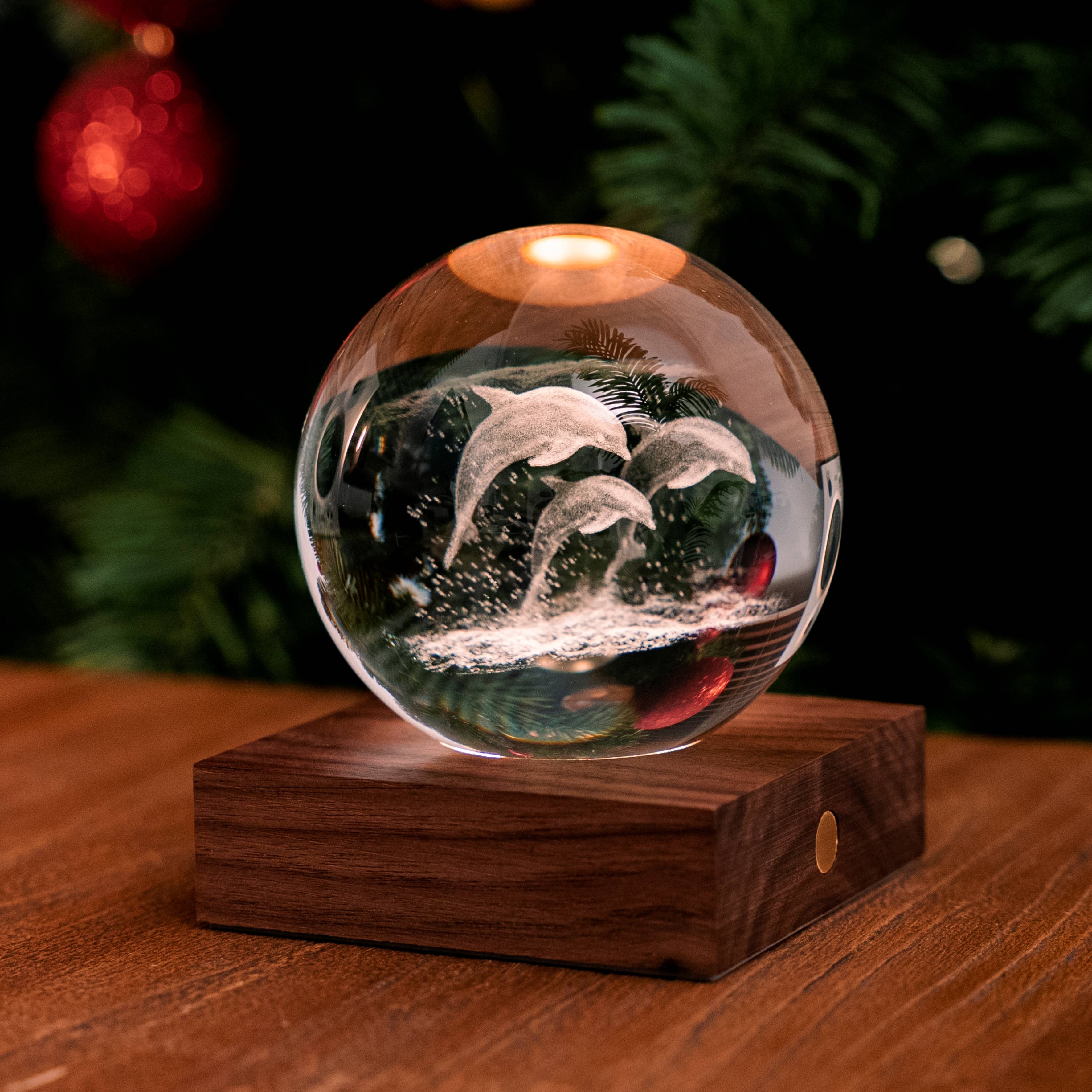 Amber Crystal Light Dandelion: dolphin-engraved crystal globe on wood base