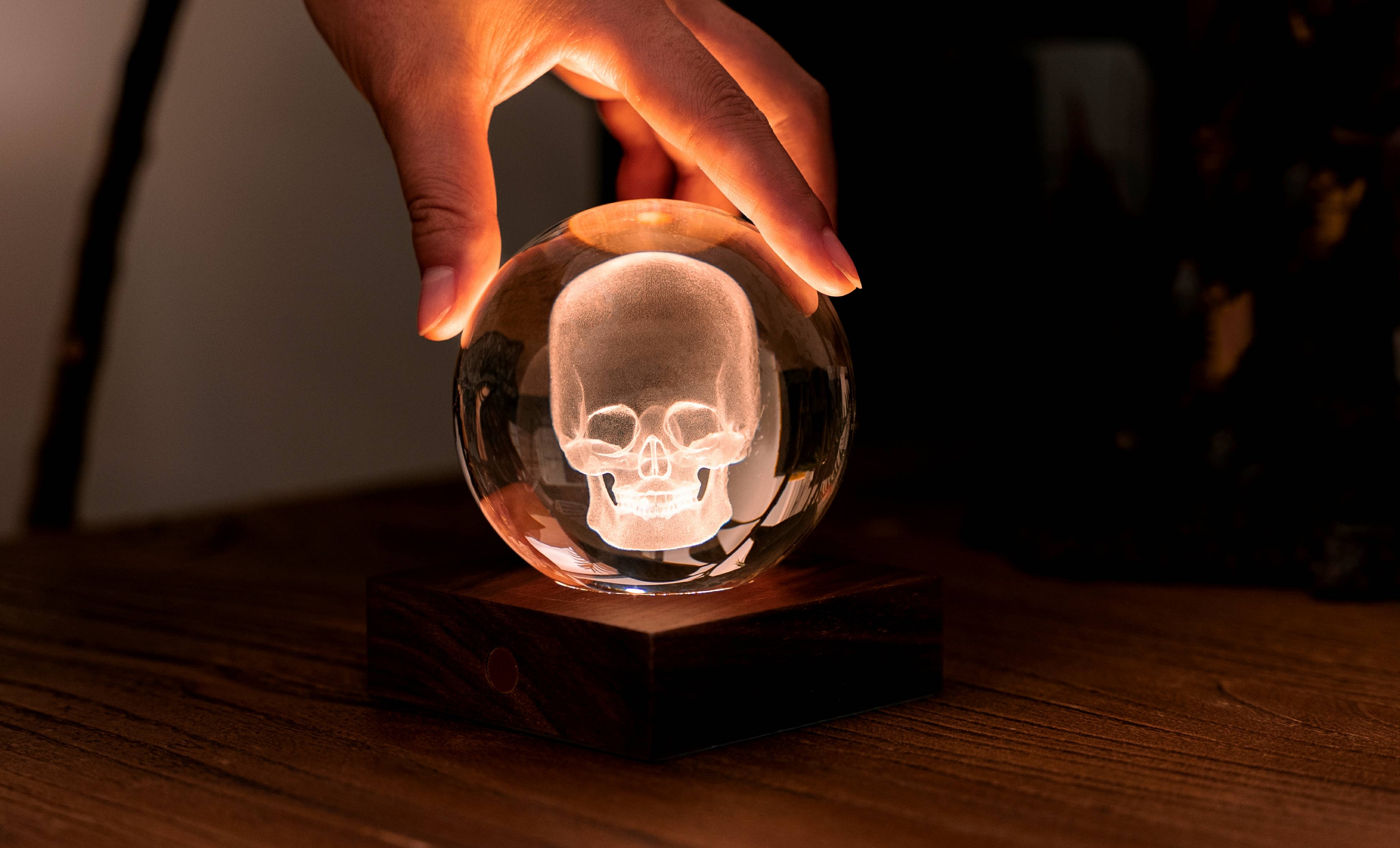 Glowing skull in translucent glass sphere of Amber Crystal Light Golf