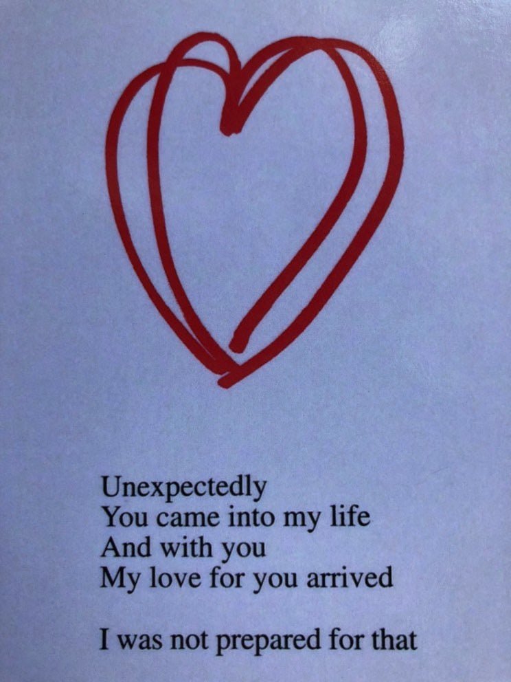 Hand-drawn red heart sketch on light blue paper with Basia Palka poem card text