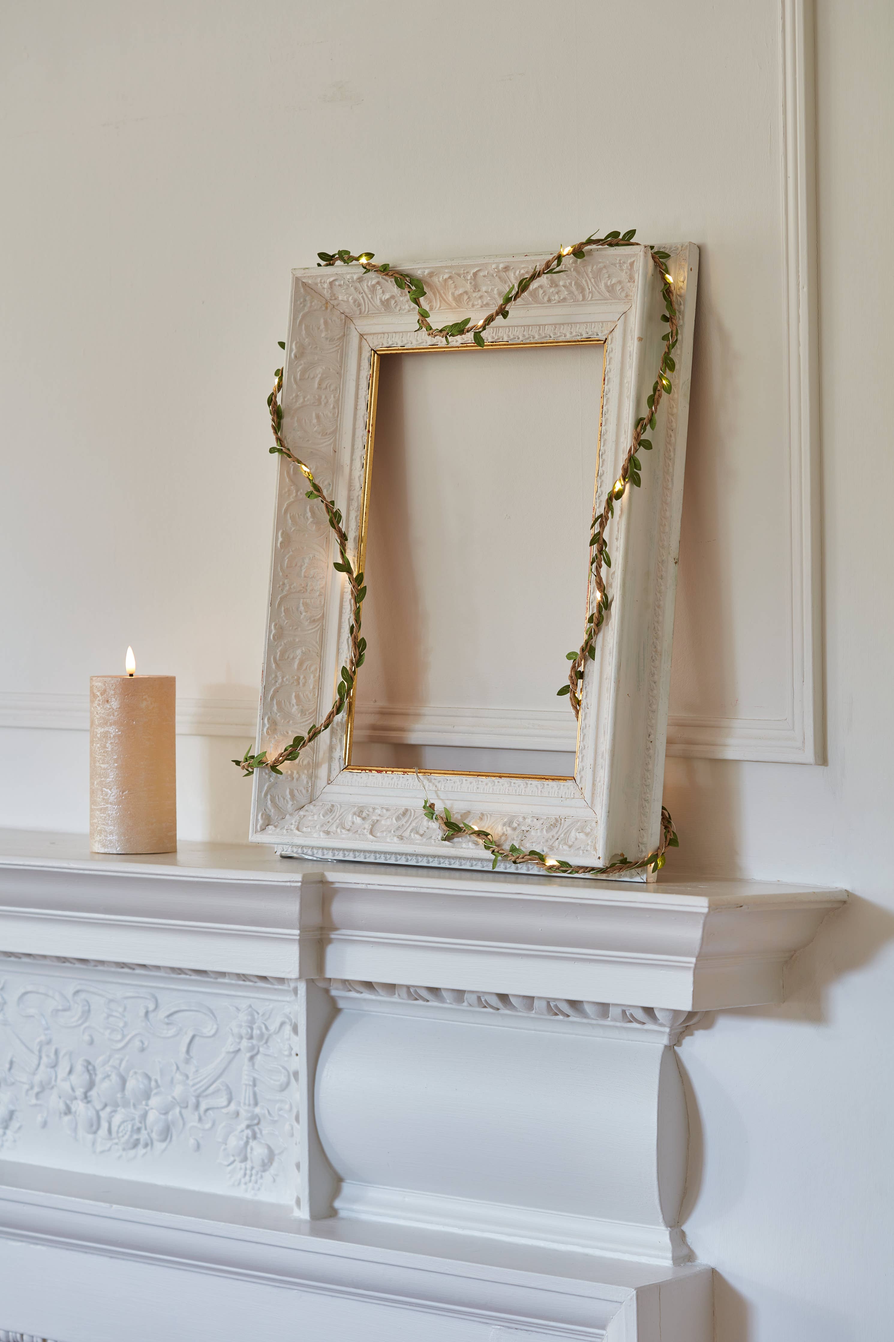 Ornate white Leaf Twine picture frame with gold edges and leaf garland