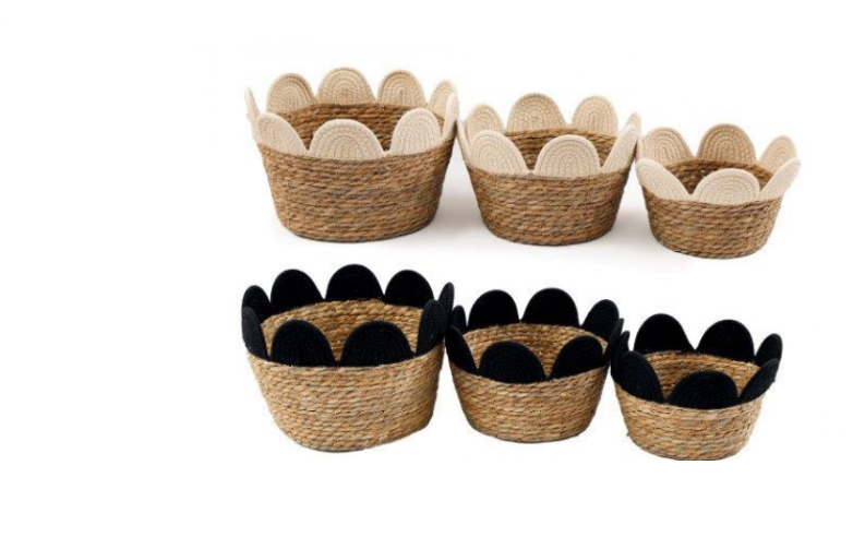 Medium black wicker flower basket with seagrass weave and scalloped cream-black trim