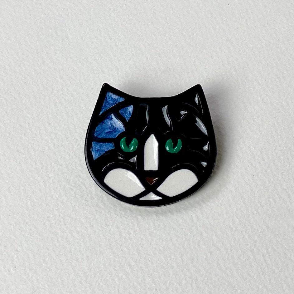 Black cat enamel pin with blue mosaic ears, green eyes, white muzzle brooch