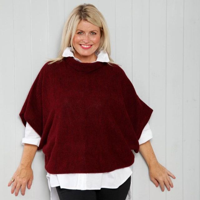Cozy Bordeaux Cowl Poncho Top in deep red knit over white shirt
