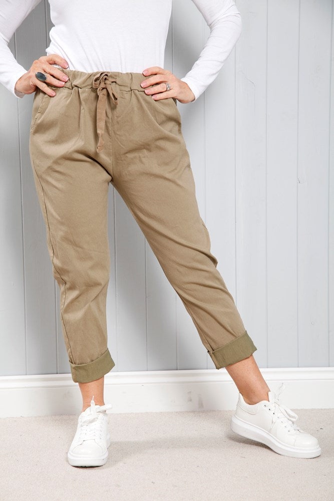 Camel Magic Pants: beige drawstring cargo pants with rolled cuffs
