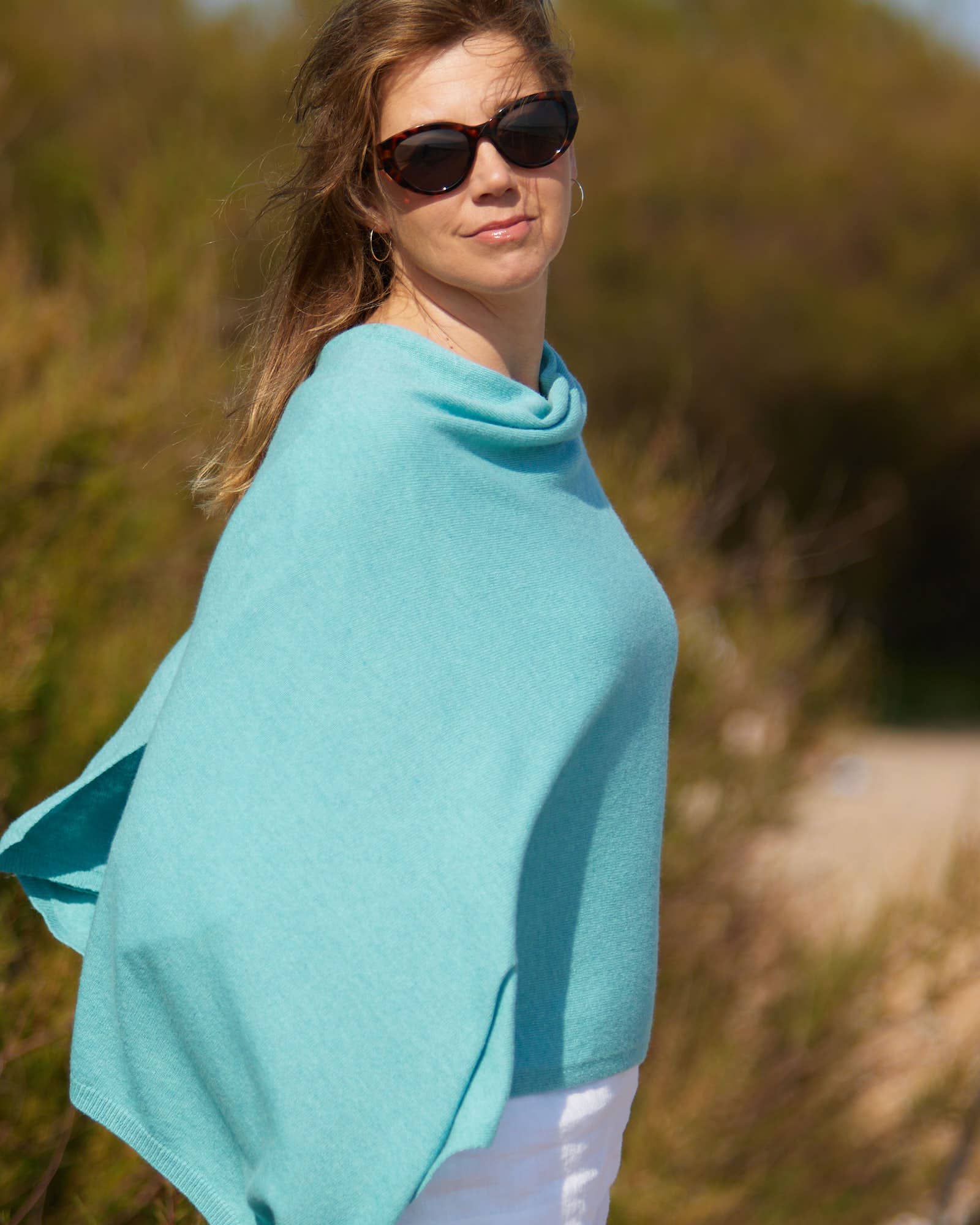 Soft light blue cashmere blend poncho with draped cowl neckline