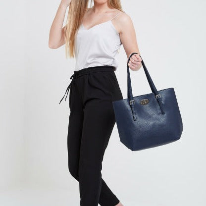 Navy blue leather Cobalt Tote Bag with black handles and gold hardware