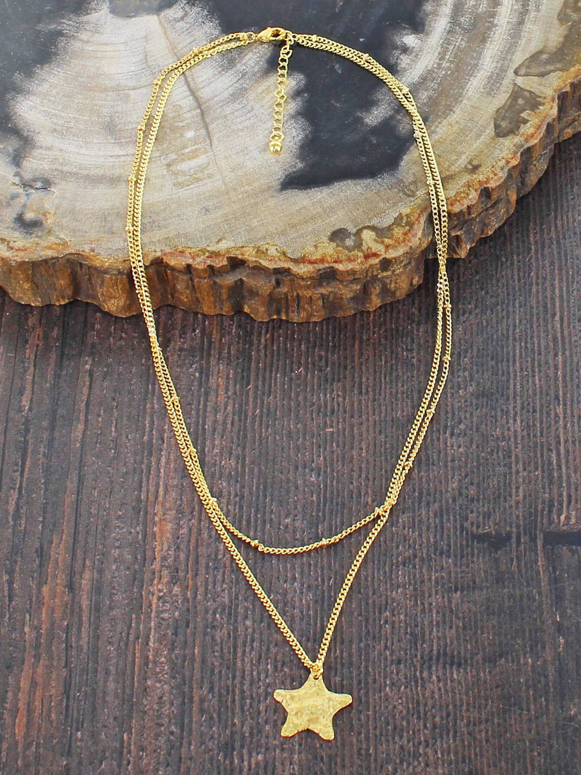 Gold-plated double strand necklace with textured star pendant