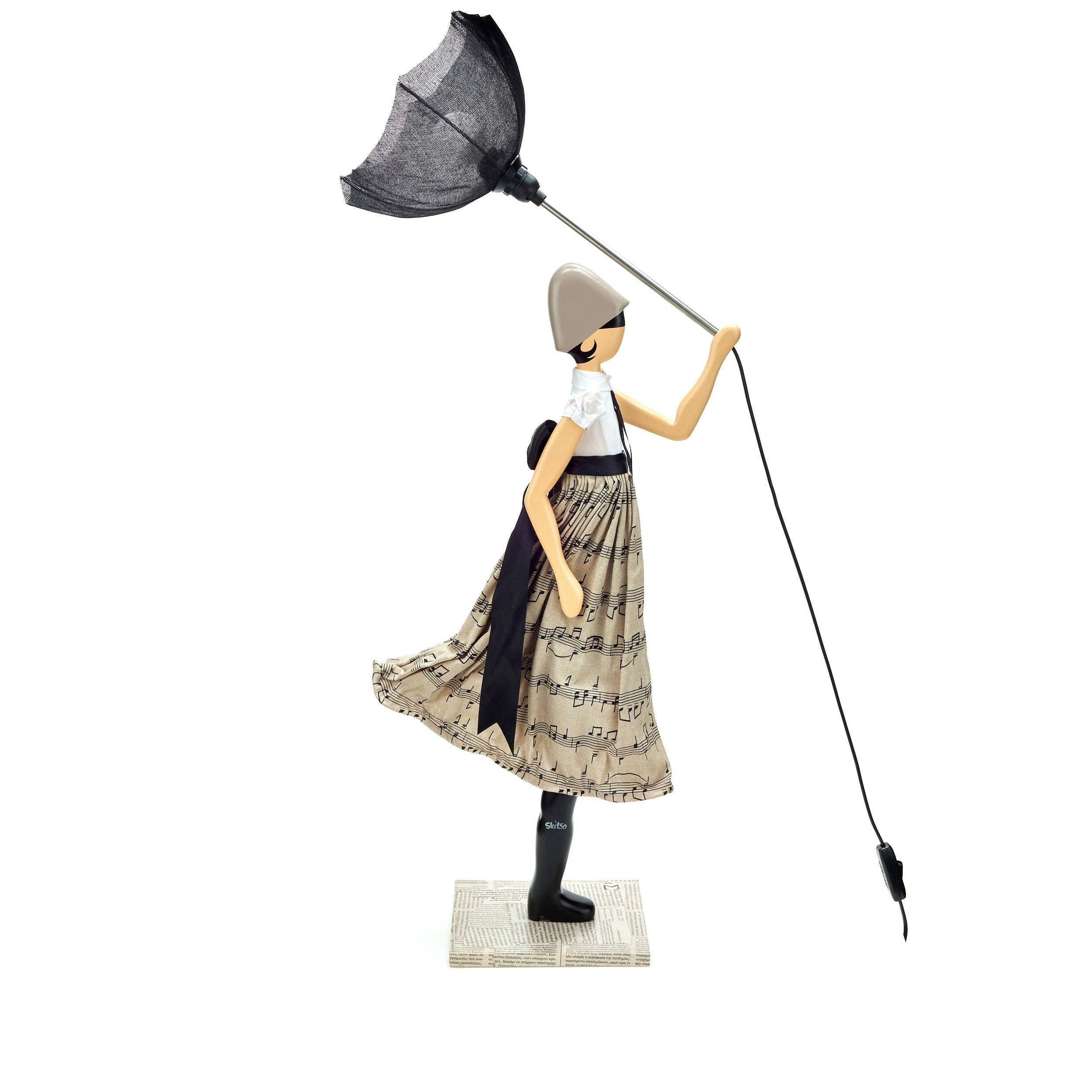 Whimsical Georgia Lady Lamp figurine with woman in musical note dress holding umbrella light