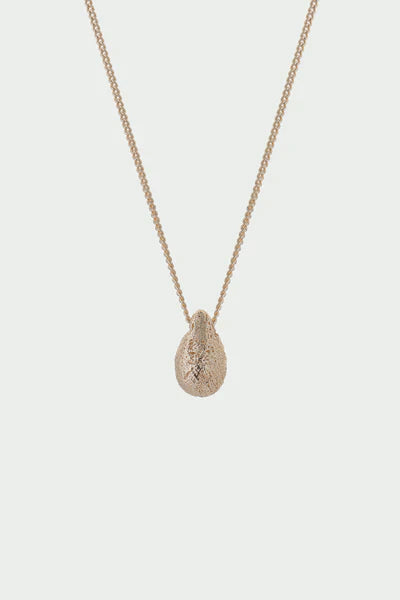Delicate gold-toned Gold Dome Necklace with textured teardrop pendant
