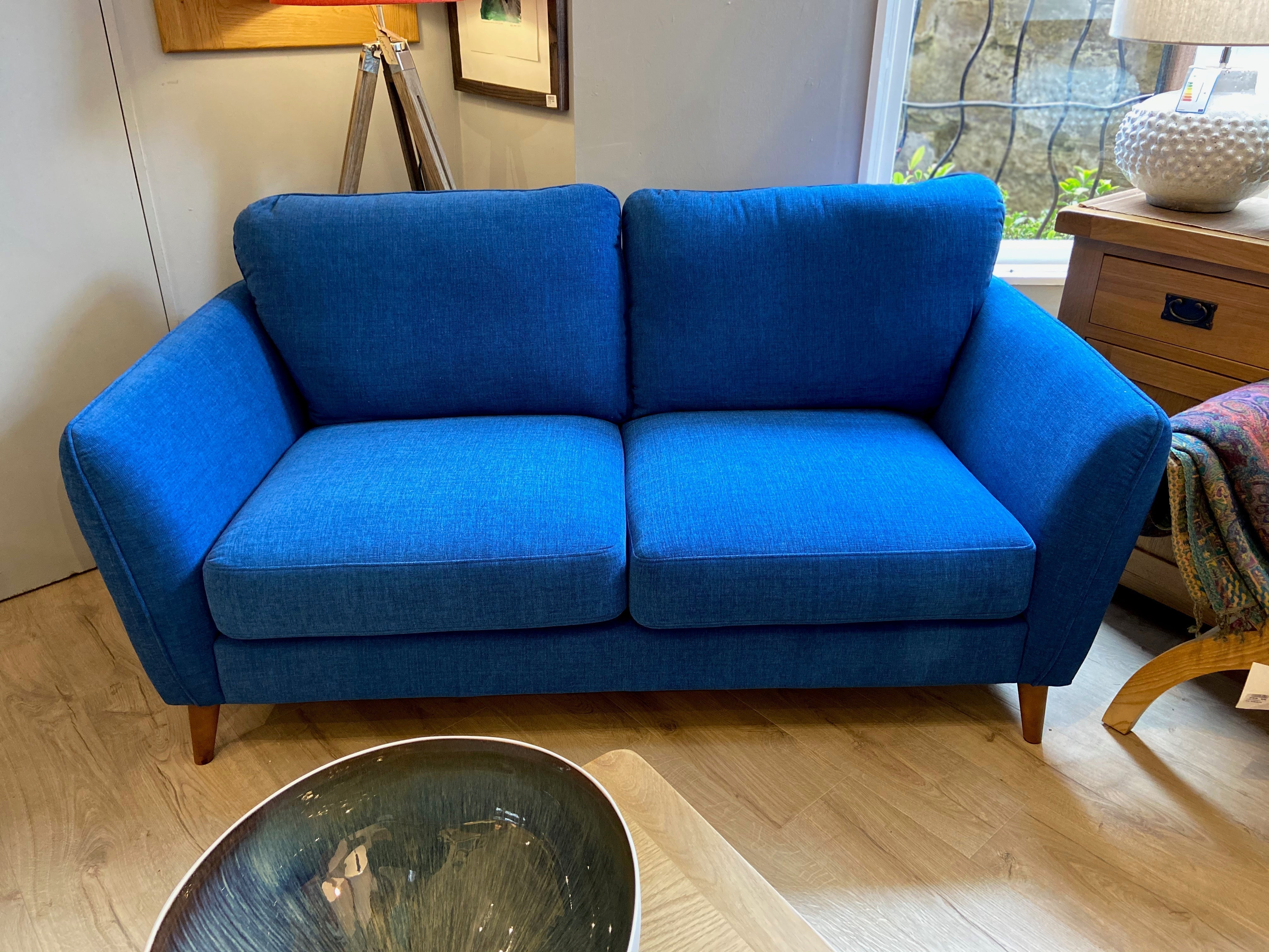 Vibrant blue Lydia 2-seater sofa with wooden legs