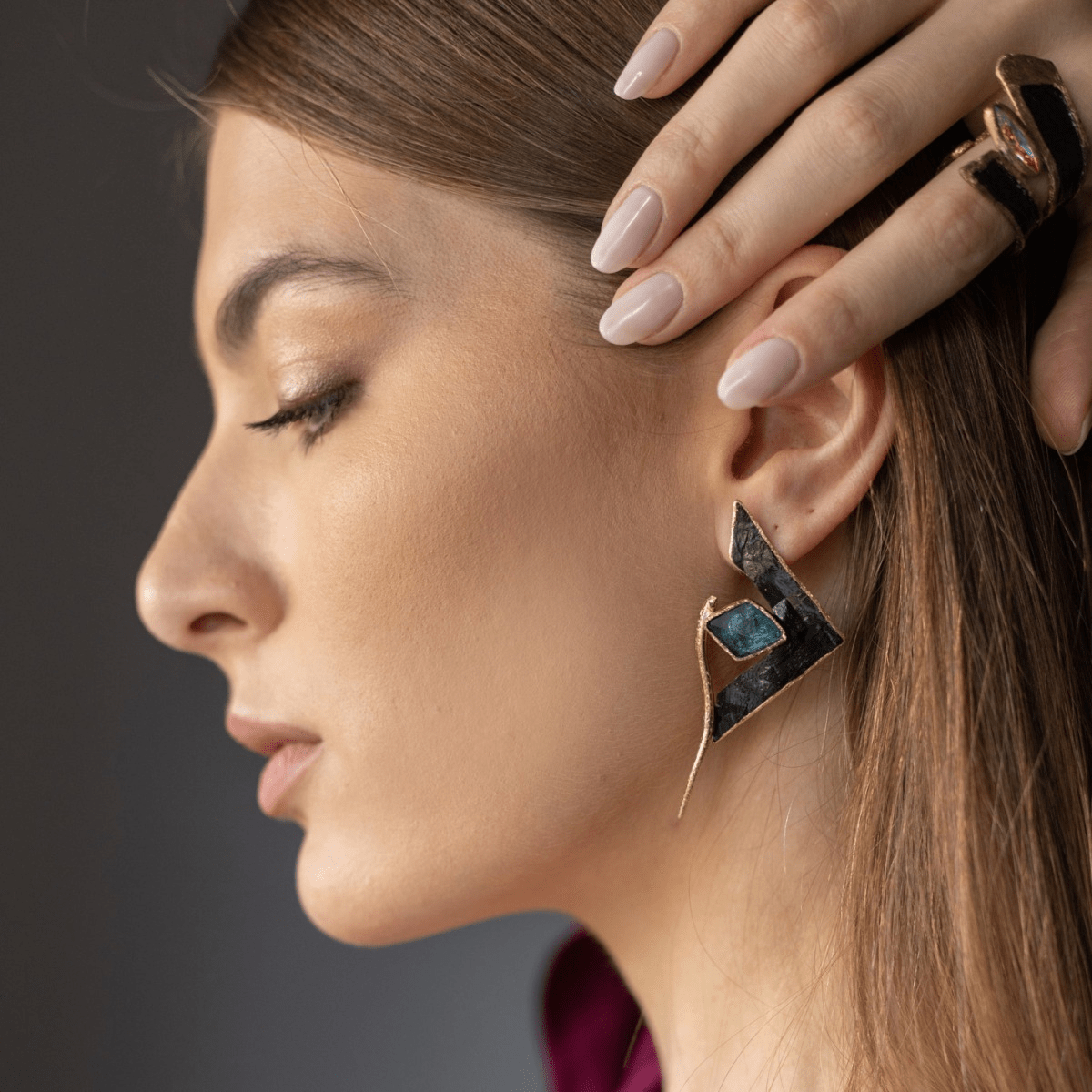 Geometric black and teal stone Mata Earrings with gold-tone frame