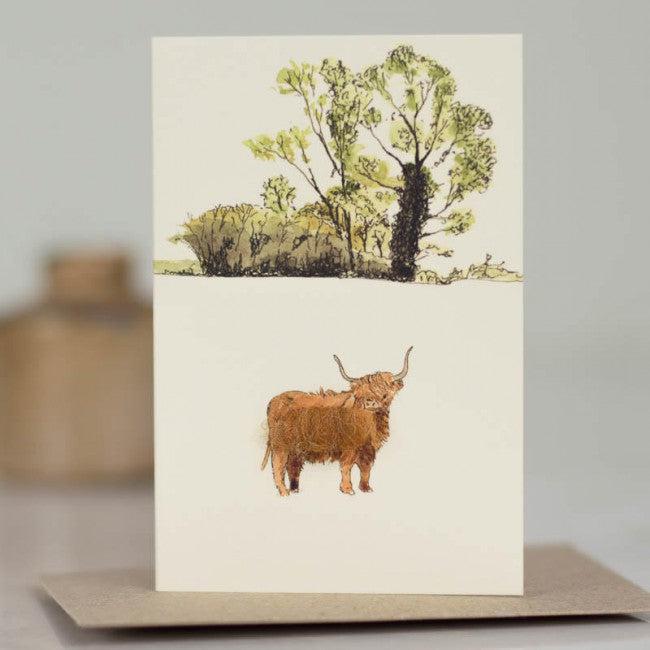Mini Highland Cow by Oak Tree greeting card with brown cow and green trees
