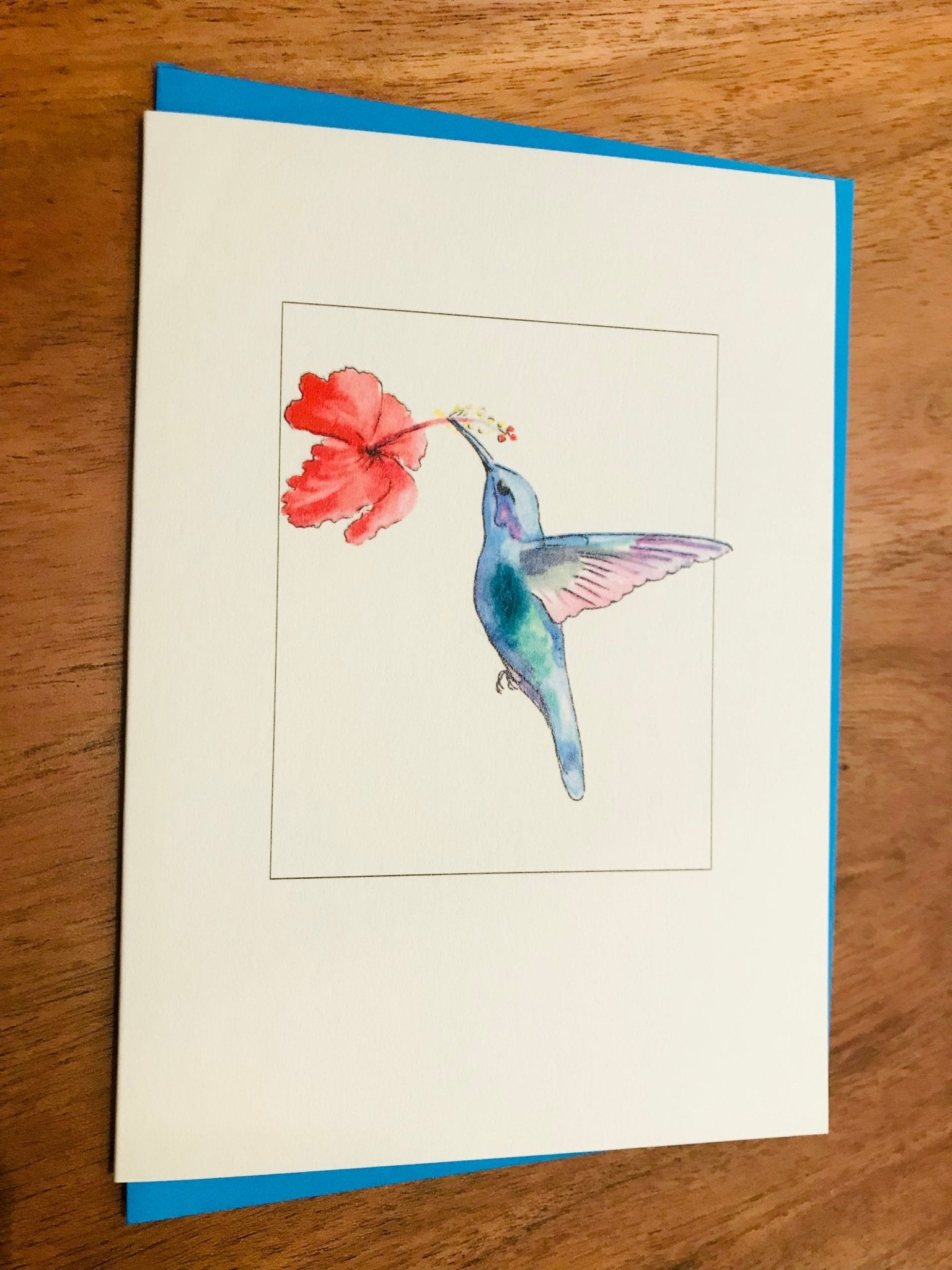 Watercolor blue purple hummingbird on hibiscus greeting card