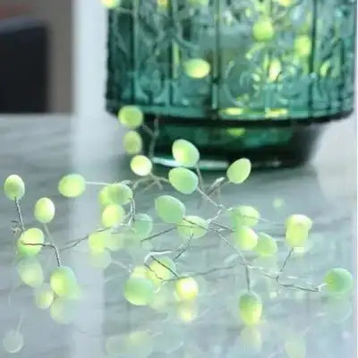Pale green artificial berry garland with silver wire stems.