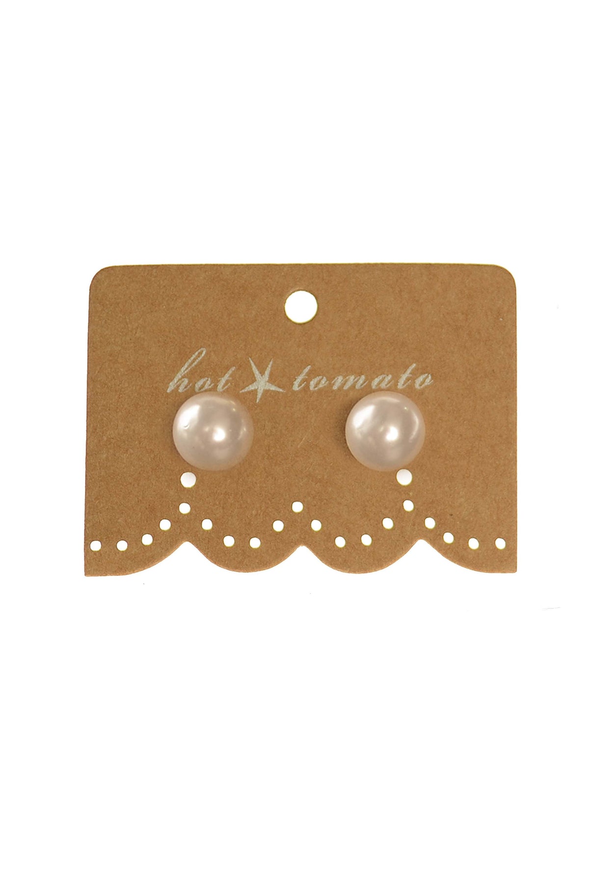 Pearl stud earrings on brown cardboard display card
