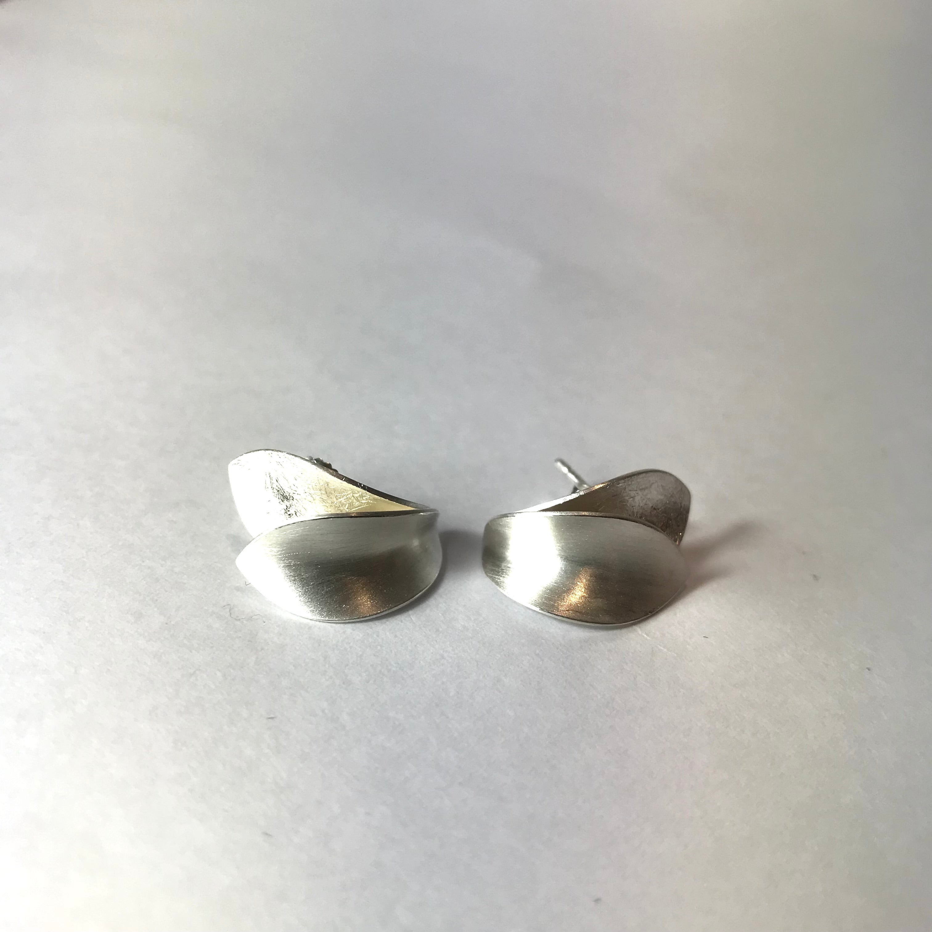 Silver minimalist stud earrings with layered leaf design
