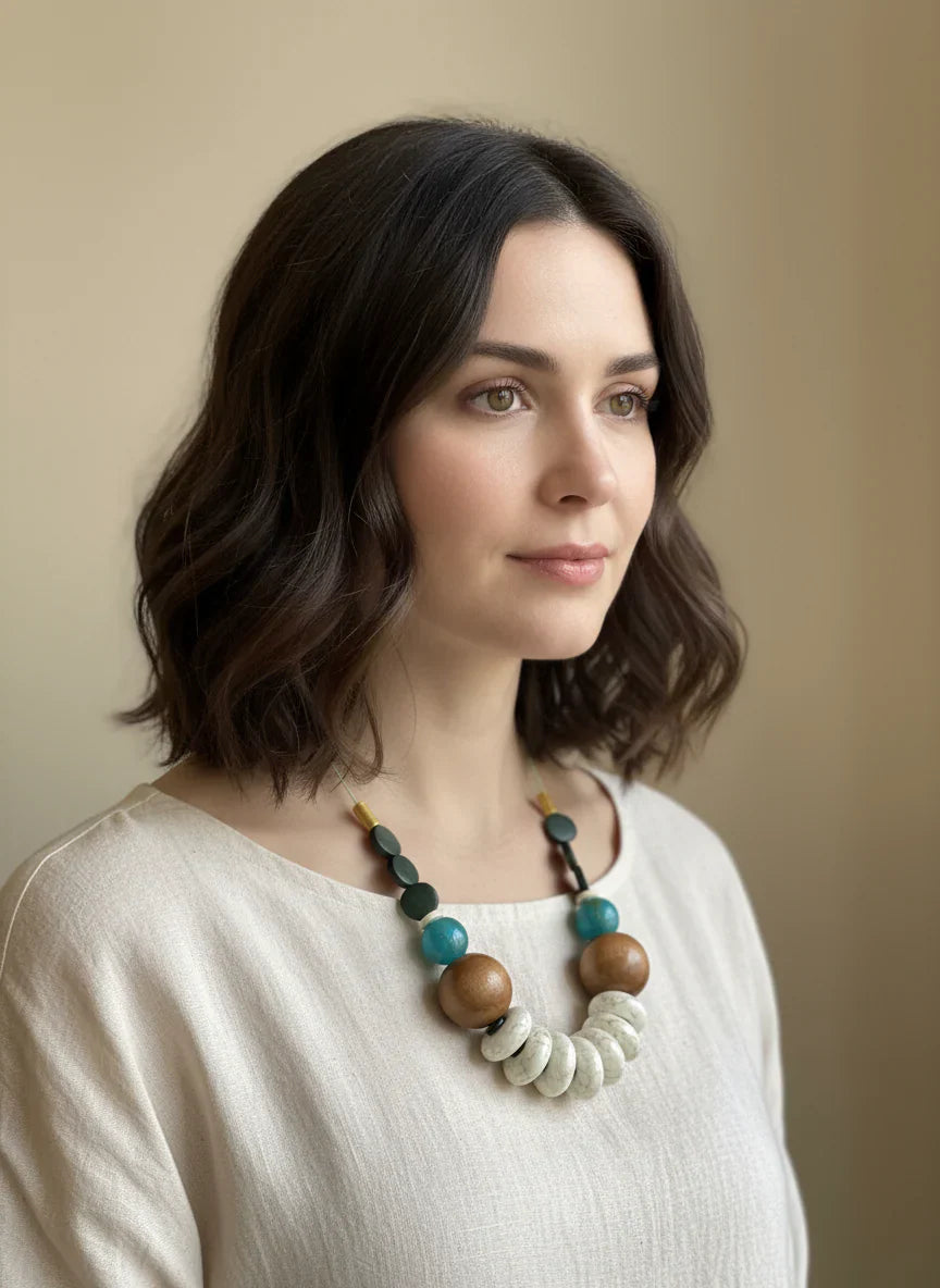 Turq Wood Green Cord necklace with wooden beads, turquoise accents, and spiral beads