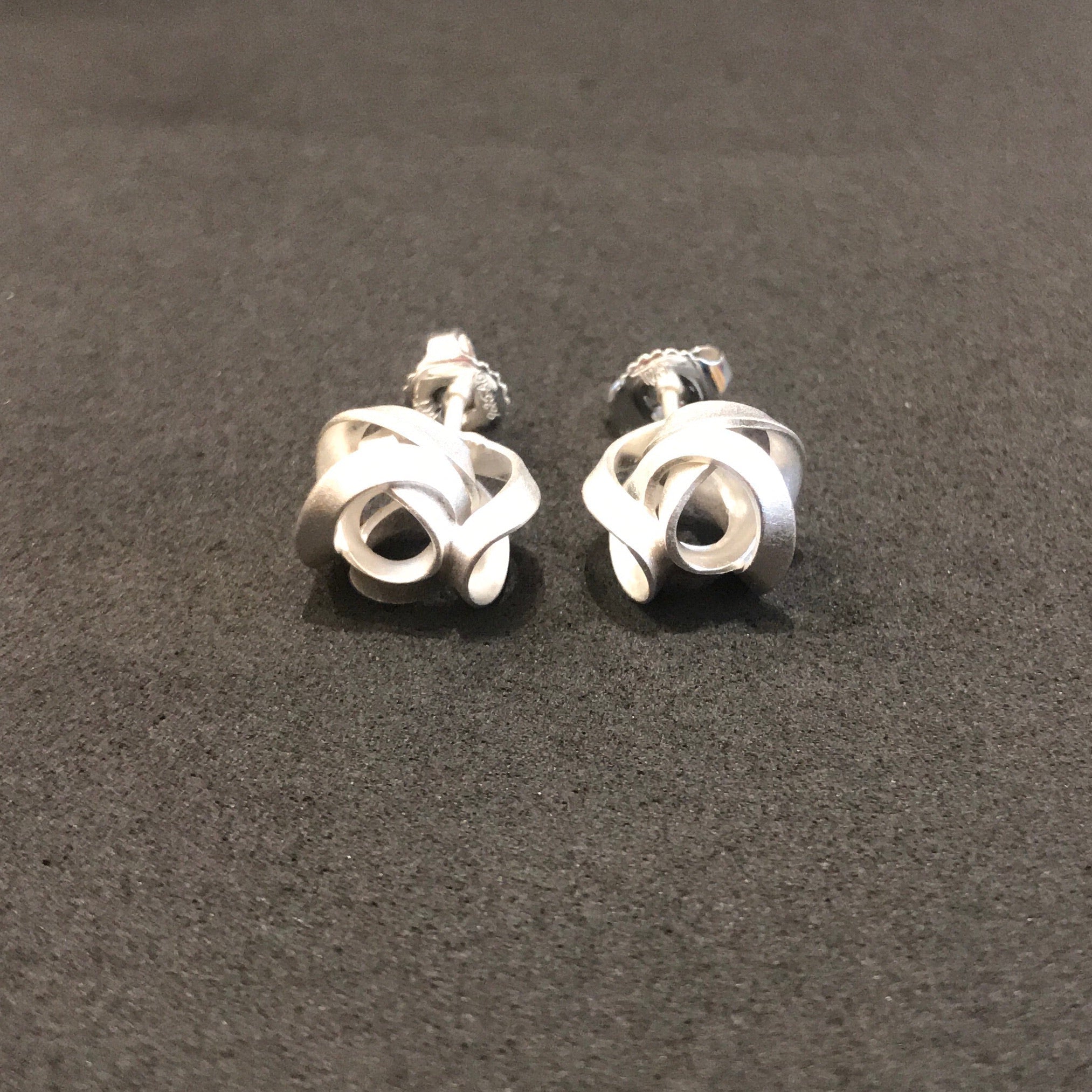 Silver Twist Stud Earrings with Rose-Shaped Intertwined Design