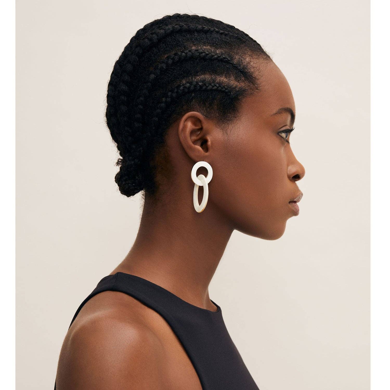 White minimalist double-ring horn earring with sleek modern design