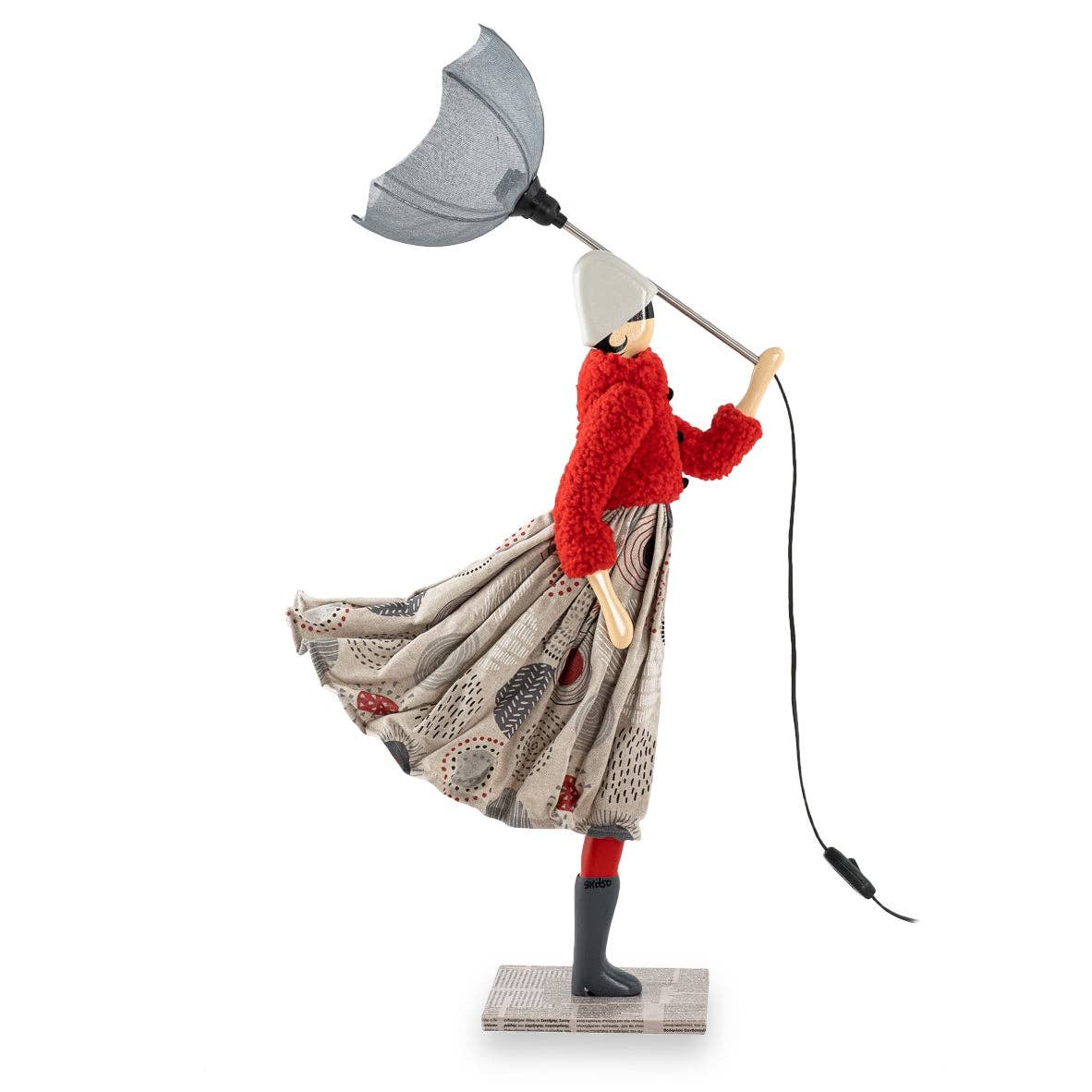 Tammy Lady Lamp: whimsical figurine with woman in red coat and skirt holding umbrella light