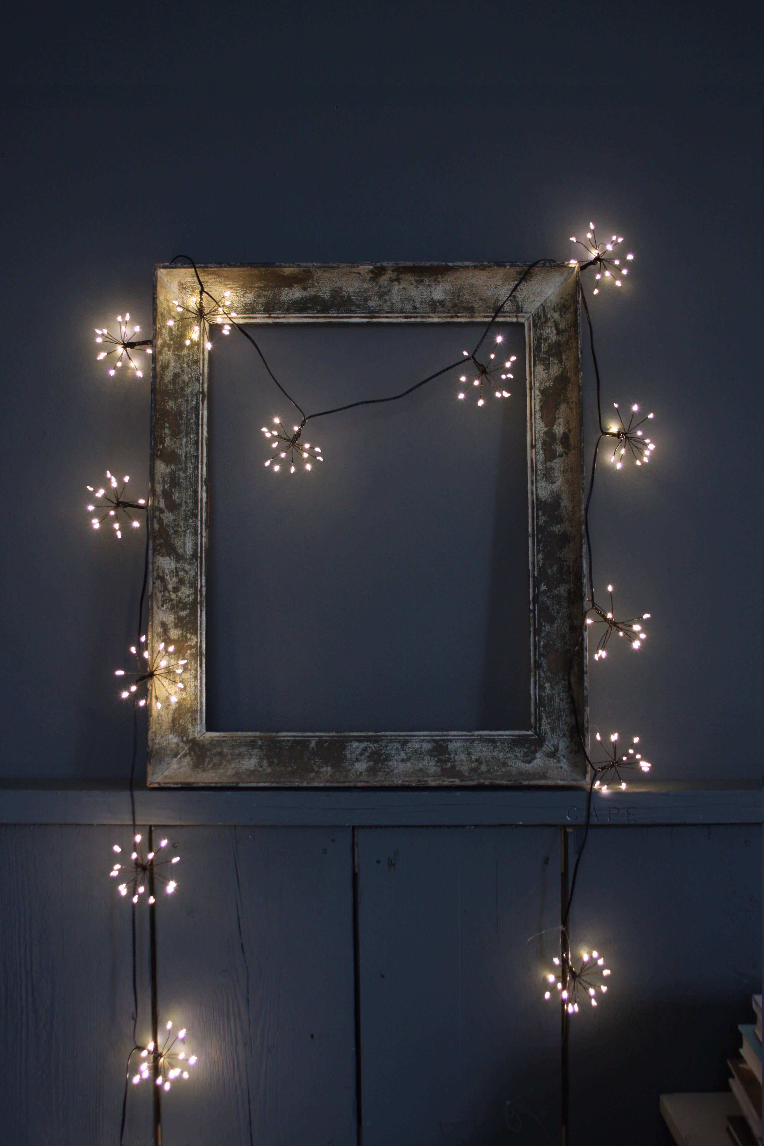 Warm white LED starburst fairy lights, black battery chain