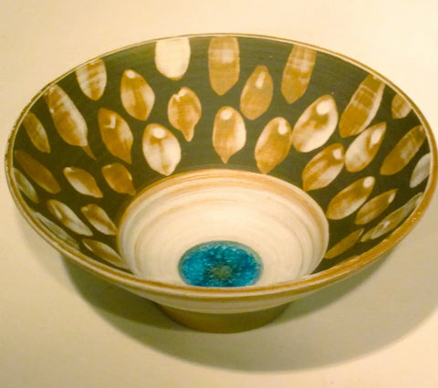 Nancy’s Story: Ceramic bowl with dark green exterior, gold leaf patterns, blue center