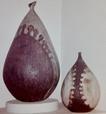 Nancy’s handcrafted teardrop ceramic vases in brown, gray glazes