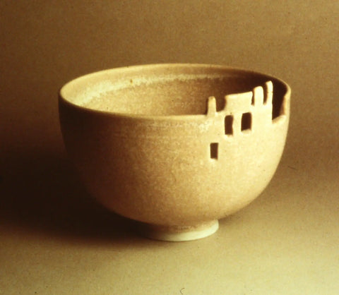 Beige textured ceramic bowl with architectural cut-out rim in Nancys Story