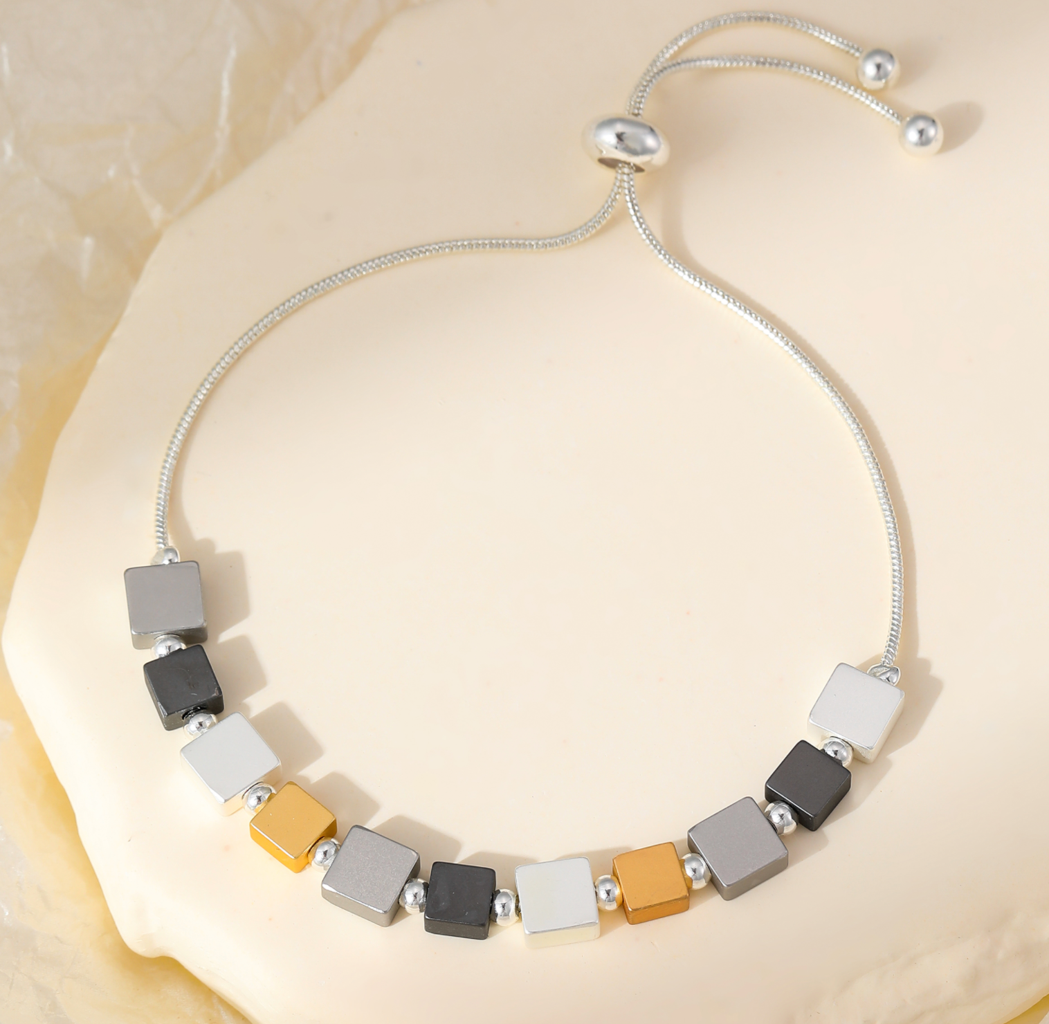 Pulsera de cubos de oro y plata