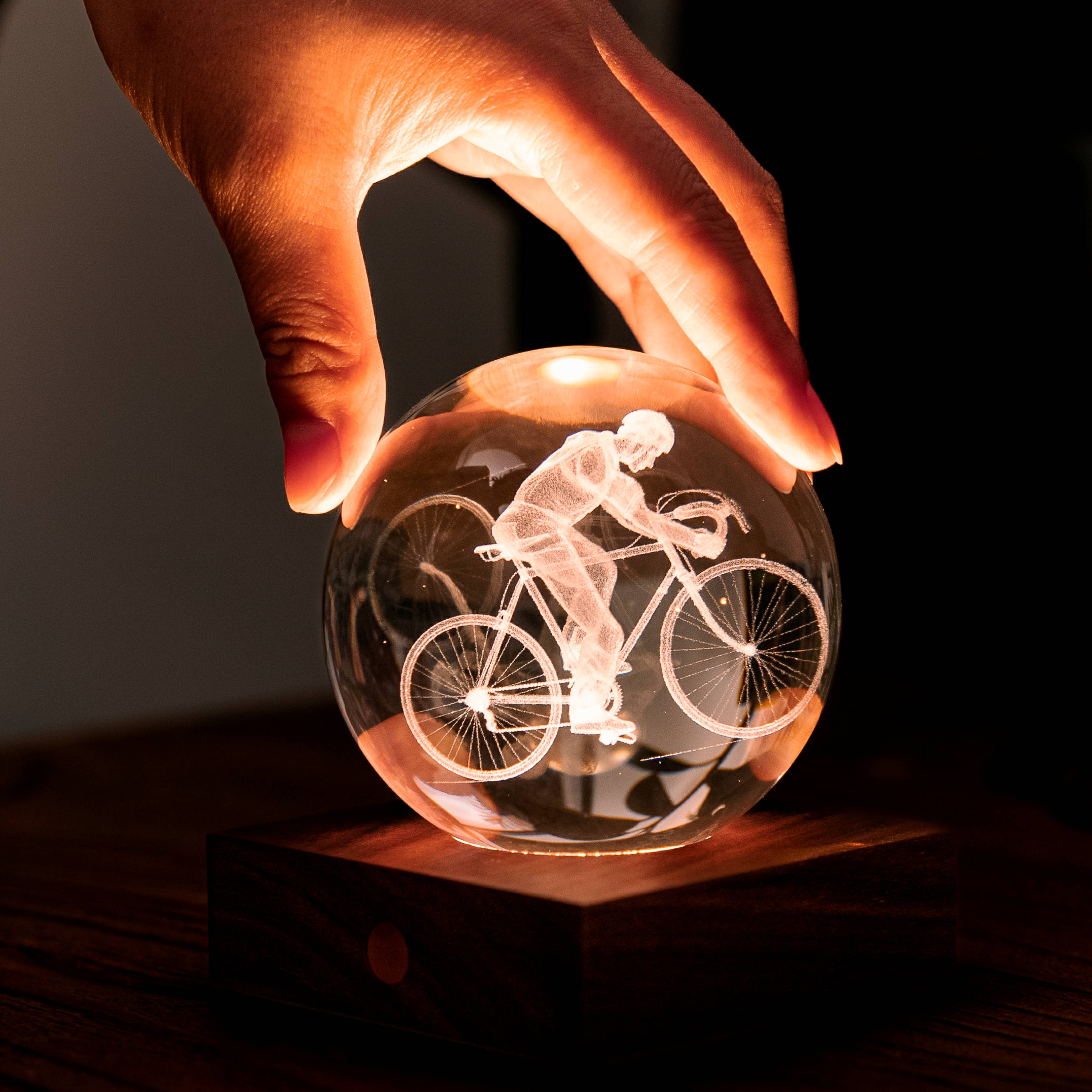 Illuminated Amber Crystal Light Golf with etched cyclist silhouette