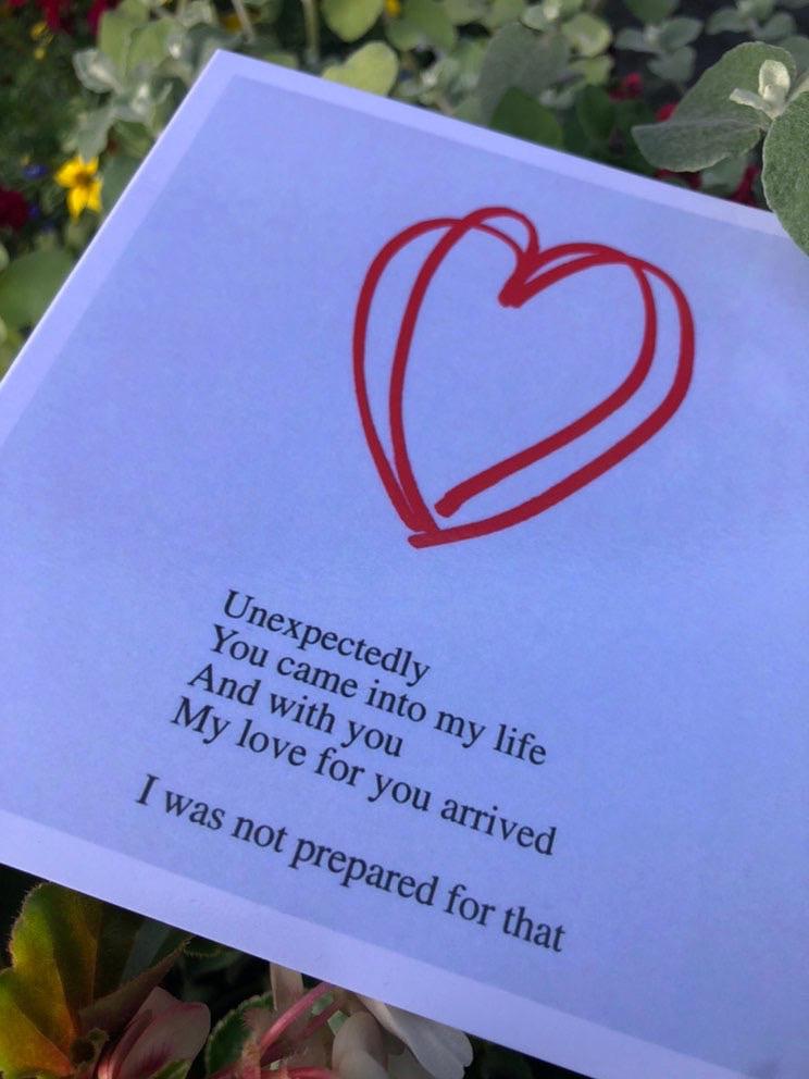Basia Palka Poem Card: white card with red hand-drawn heart and text on unexpected love