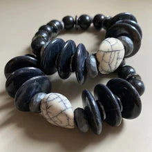 Black and white stone bead bracelet with smooth dark beads and patterned light stones