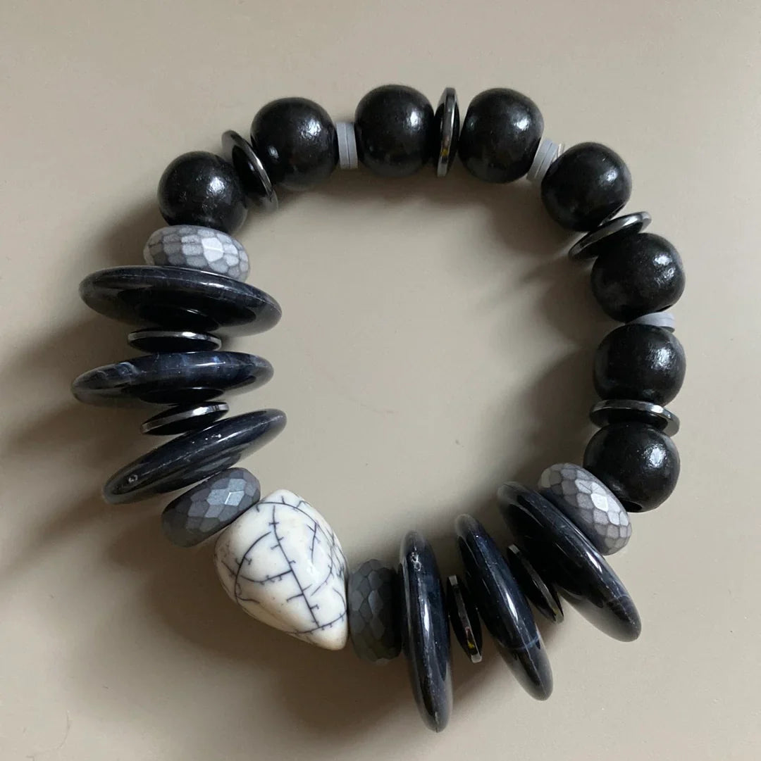Black and white beaded bracelet with glossy disc beads