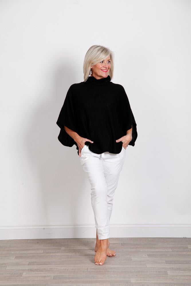 Black turtleneck poncho top in stylish black fabric