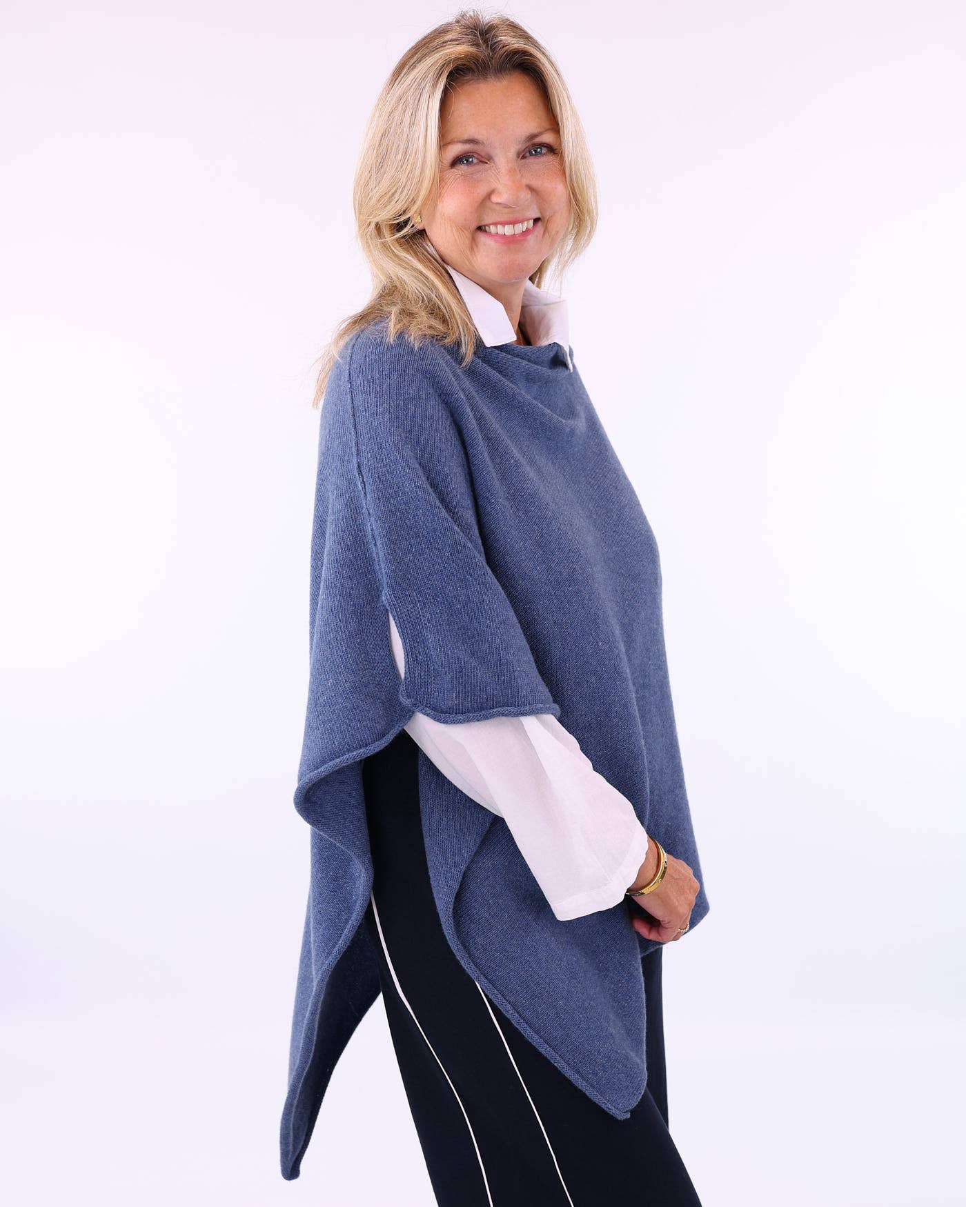 Soft medium-blue cashmere blend poncho with draped asymmetrical hemline