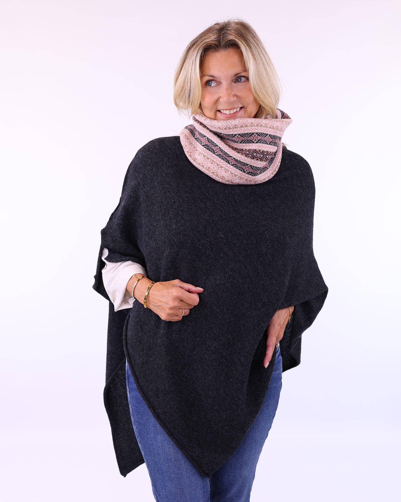 Black olive cashmere blend knitted poncho with textured weave and asymmetrical hem