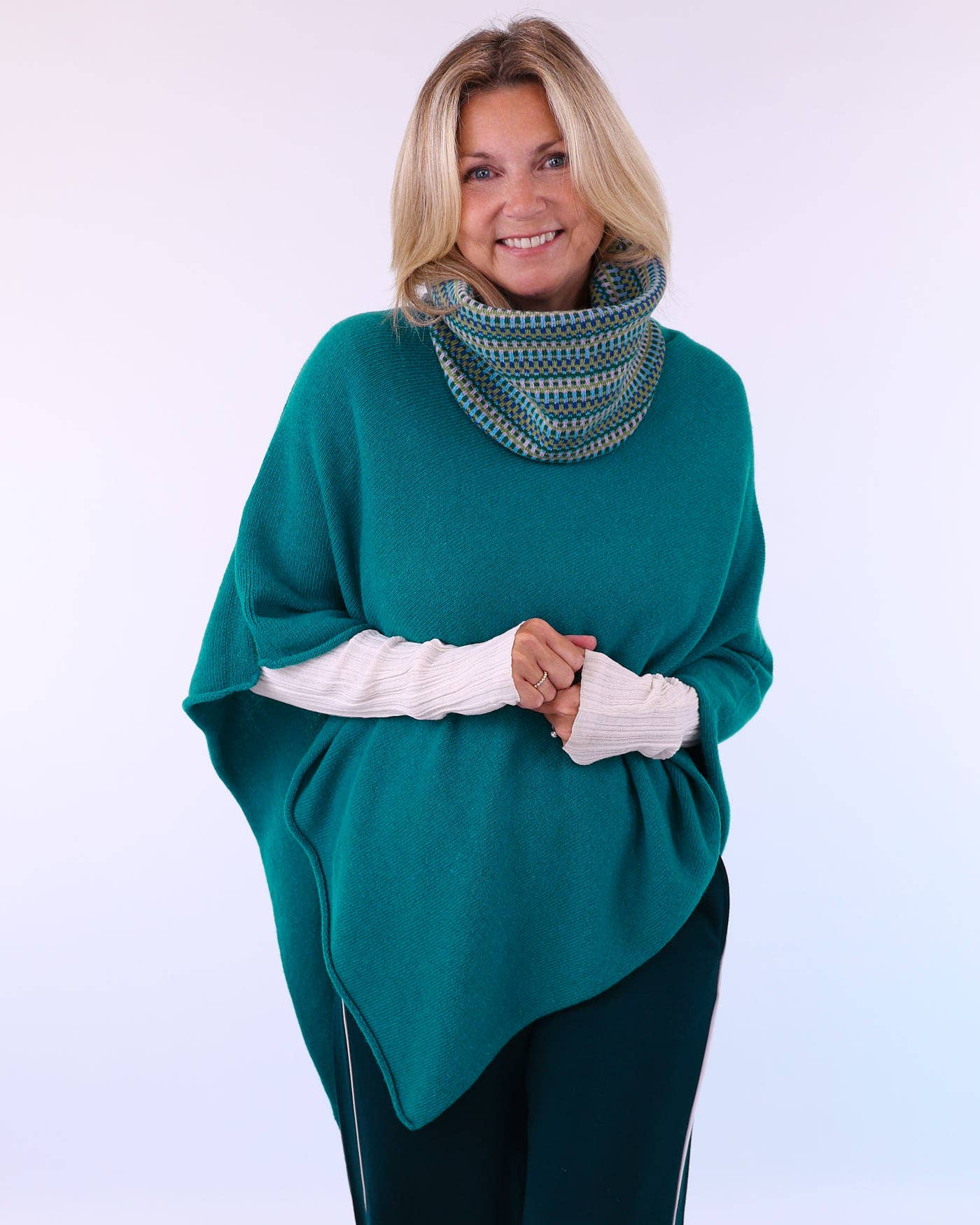 Teal cashmere blend poncho with olive patterned cowl neckline
