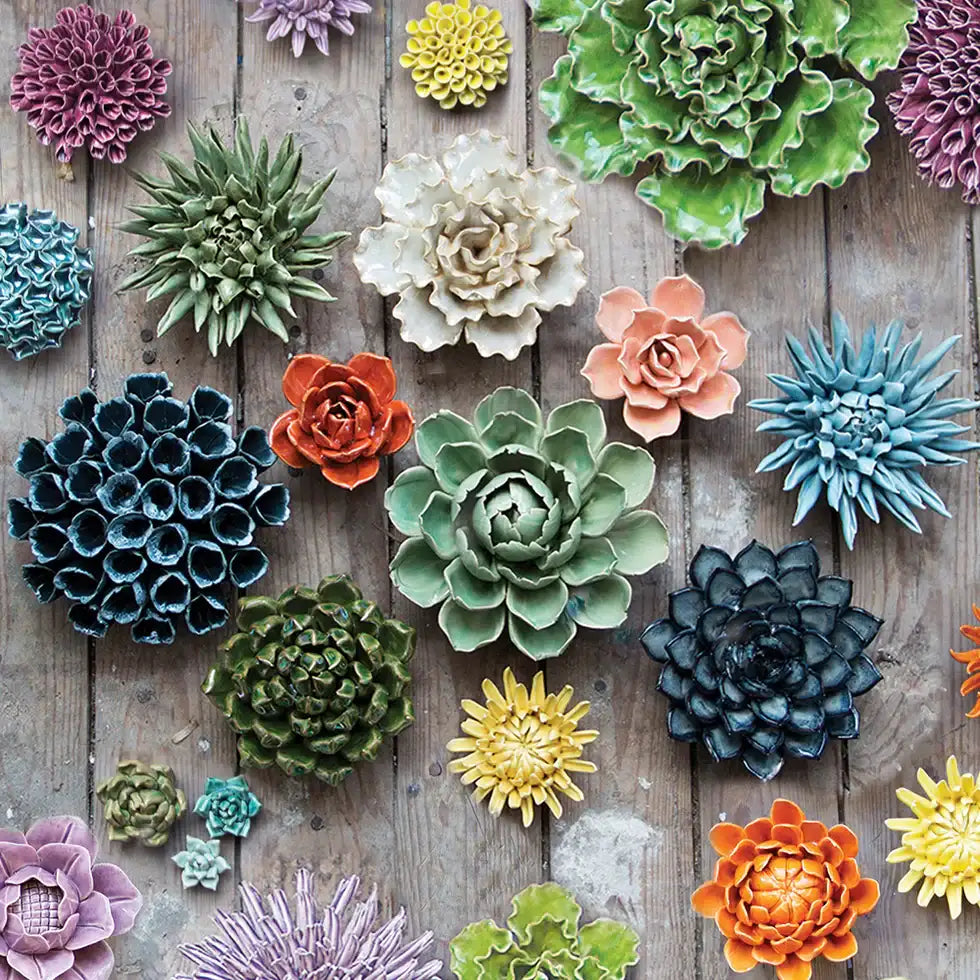 Ceramic succulent wall decor in various vibrant colors and textures, resembling natural plants.