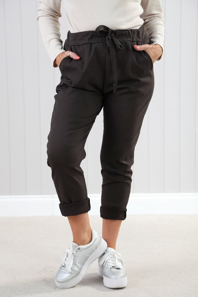 Charcoal Magic Pants: black drawstring joggers with rolled cuffs