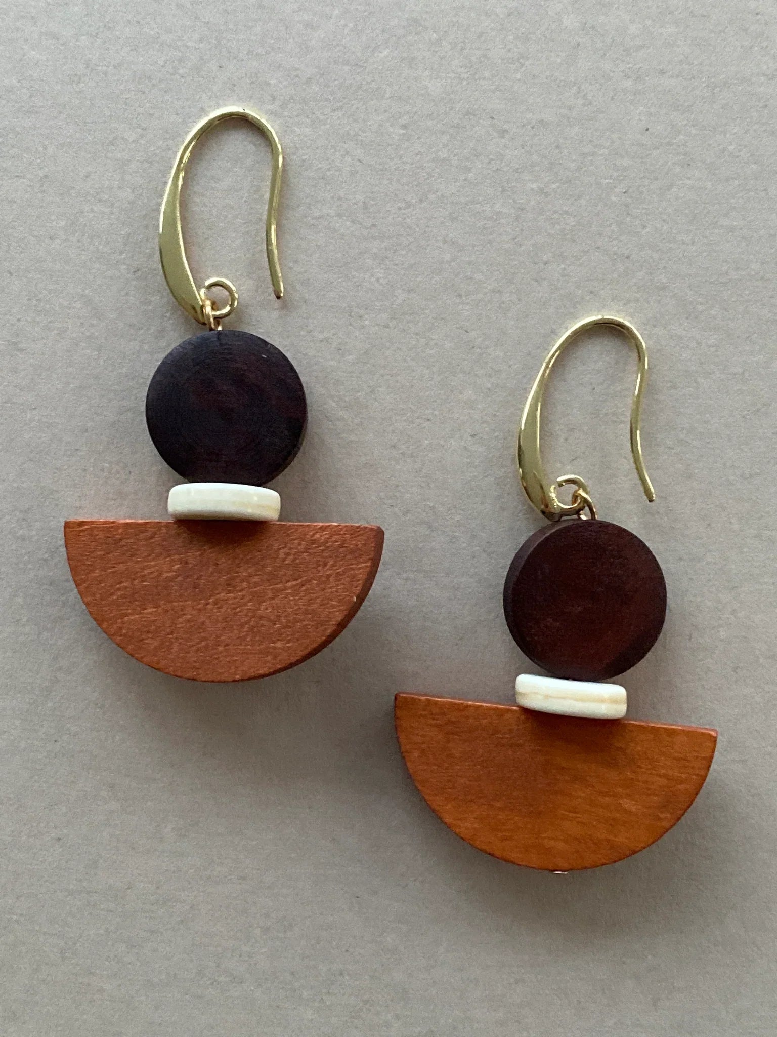 Choc Orange wooden drop earrings with geometric brown, white, orange design