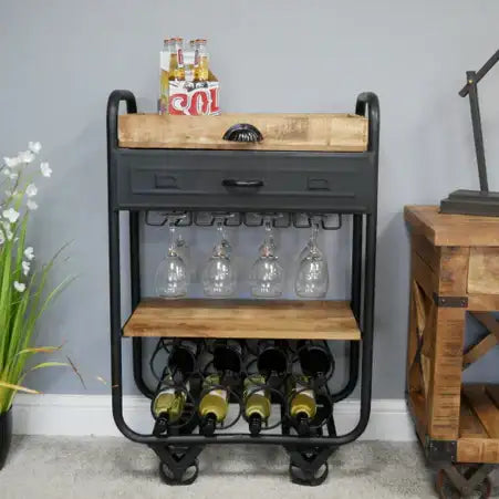 Dark gray industrial-style wine rack with wooden shelves and metal accents, holding bottles of wine and glasses.