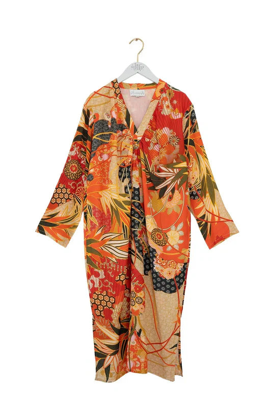Vibrant orange and beige floral kimono-style midi dress on hanger