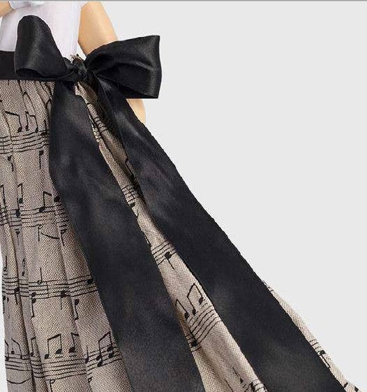 Black satin bow on Georgia Lady Lamp doll in musical note skirt