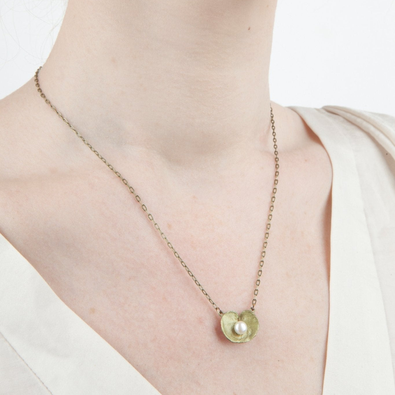 Delicate gold Geranium Pendant necklace with pearl shell