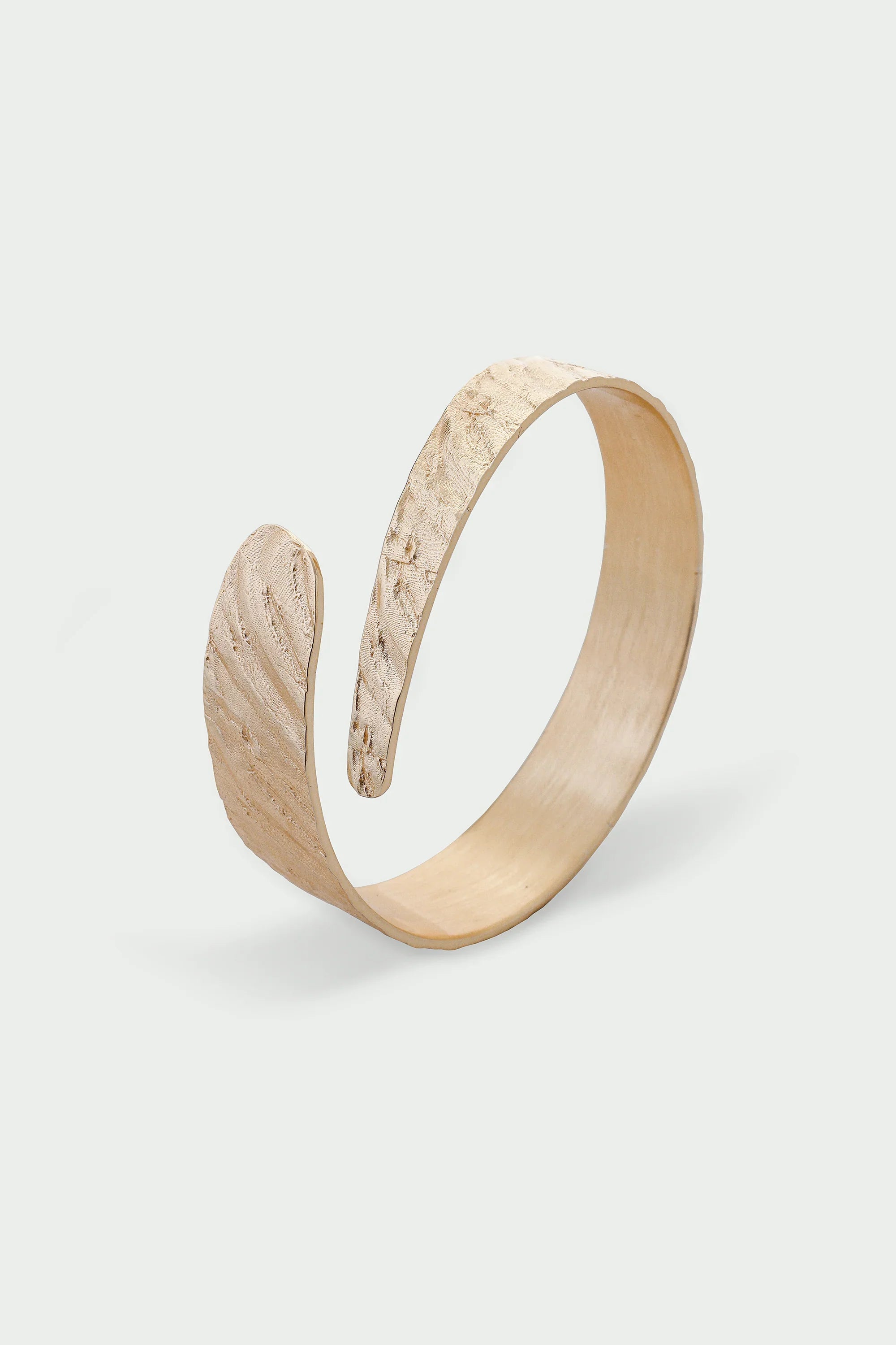 Gold Riva Bangle with textured feather-like design